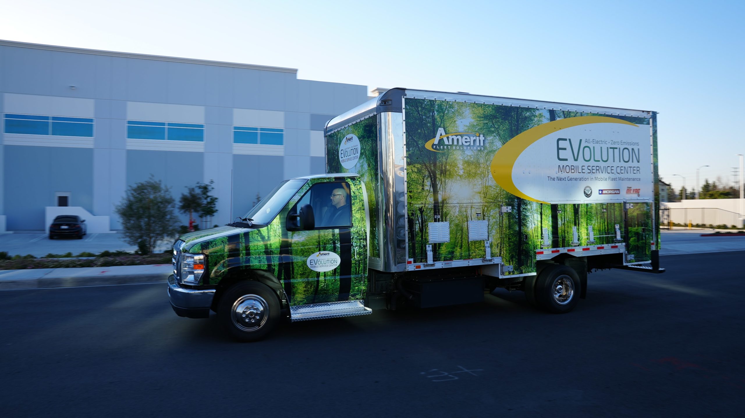 An Amerit electric service vehicle on the road.