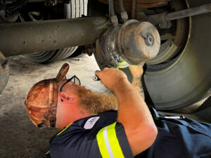 Amerit technician offering fleet services for a class 8 vehicle.