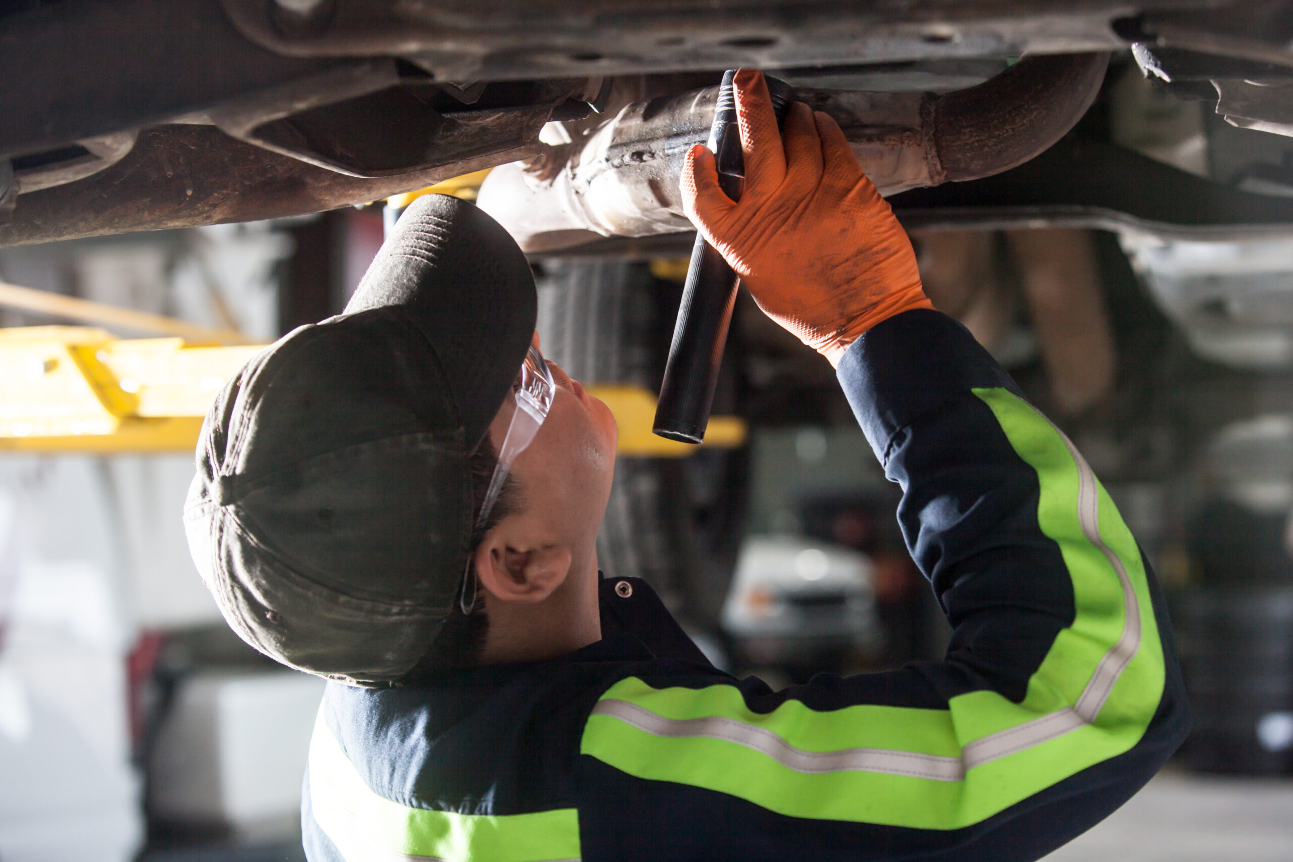 Amerit and Vector technician delivering fleet management and maintenance services for vehicle.