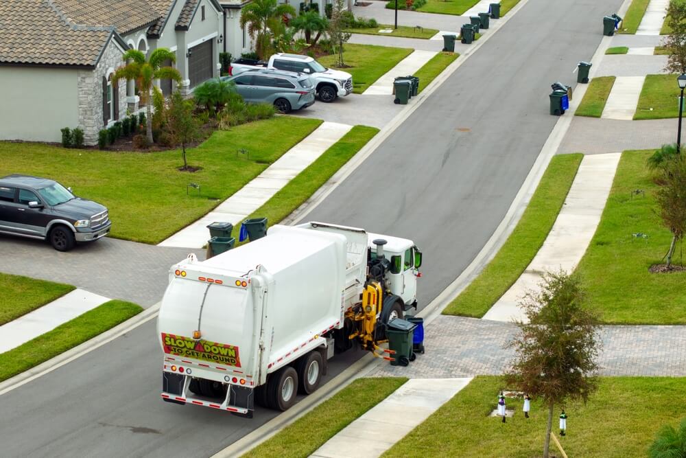 Types of waste collection vehicles, including residential waste and recycling truck.