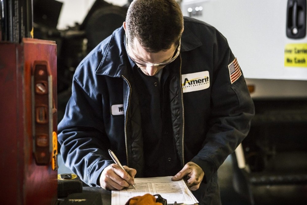 Amerit technician on site capturing fleet maintenance data.
