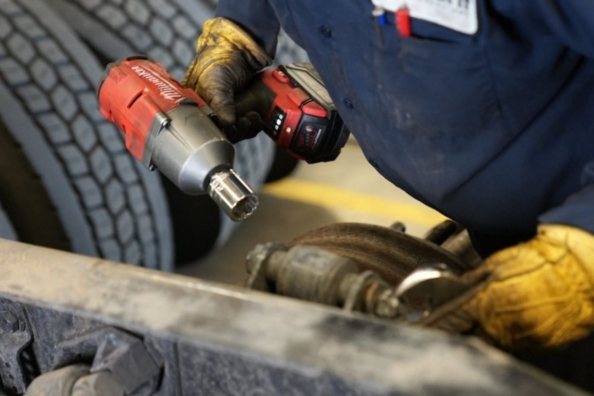 technician repairing armored truck