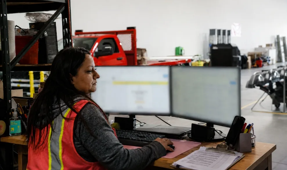 Amerit employee reviewing documentation for repairs and costs